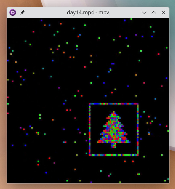 Screenshot of a video still showing colourful dots, a bunch of them
arranged to form a Christmas tree.